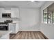 Bright kitchen with modern white cabinets and stainless steel appliances, offering a clean aesthetic at 4956 W 11Th St, Speedway, IN 46224