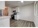 Well-lit kitchen featuring stainless appliances, white cabinets, and contemporary finishes at 4956 W 11Th St, Speedway, IN 46224
