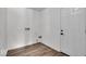 Bright laundry room with hardwood floors and fresh white walls at 4956 W 11Th St, Speedway, IN 46224