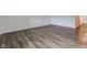 Spacious living room featuring new laminate flooring and ample natural light at 4956 W 11Th St, Speedway, IN 46224