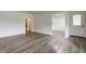 Bright living room featuring updated flooring, neutral paint, and ample natural light at 4956 W 11Th St, Speedway, IN 46224