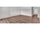 Bright living room with modern flooring, neutral paint, and ample natural light at 4956 W 11Th St, Speedway, IN 46224