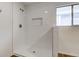 Shower with crisp white tile, offering a clean and contemporary design with plenty of light at 4956 W 11Th St, Speedway, IN 46224
