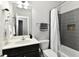 Modern bathroom with gray tiled shower and white vanity offering a clean, contemporary design at 5755 Buskirk Dr, Indianapolis, IN 46216
