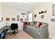 Cozy bedroom with a stylish daybed, desk, and unique wall decor, perfect for relaxation at 5755 Buskirk Dr, Indianapolis, IN 46216