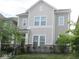Charming two-story home with inviting front porch and well-manicured lawn exudes curb appeal at 5755 Buskirk Dr, Indianapolis, IN 46216