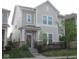Charming two-story home with inviting front porch and well-manicured lawn exudes curb appeal at 5755 Buskirk Dr, Indianapolis, IN 46216