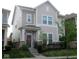 Charming two-story home with neutral siding, a welcoming porch, and a well-manicured front lawn at 5755 Buskirk Dr, Indianapolis, IN 46216