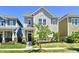 Charming two-story home with a well-maintained lawn, landscaped garden, and inviting front porch at 5755 Buskirk Dr, Indianapolis, IN 46216