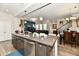 Open-concept kitchen boasts a spacious island, stainless steel appliances, and seamless flow to living spaces at 5755 Buskirk Dr, Indianapolis, IN 46216