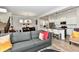 Inviting living room with hardwood floors, open to kitchen and dining spaces, perfect for gathering at 5755 Buskirk Dr, Indianapolis, IN 46216