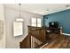 Open loft area featuring natural light, stylish furnishings, and a versatile living space at 5755 Buskirk Dr, Indianapolis, IN 46216