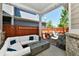 Covered patio with modern furniture and a stylish fire pit, perfect for outdoor entertaining at 5755 Buskirk Dr, Indianapolis, IN 46216