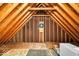 Unfinished attic space showcasing exposed beams and structural elements at 5783 Coopers Hawk Dr, Carmel, IN 46033