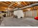 Unfinished basement with exposed ceiling, concrete walls and floor, and mechanical equipment at 5783 Coopers Hawk Dr, Carmel, IN 46033