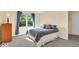 Bedroom with a bed, lamp, and window at 5783 Coopers Hawk Dr, Carmel, IN 46033