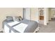 Bedroom with a bed, closet, and an ensuite bathroom at 5783 Coopers Hawk Dr, Carmel, IN 46033