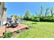 Backyard with deck, table, umbrella and chairs at 5827 High Grass Ln, Indianapolis, IN 46235