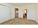 Spacious bedroom with carpet, closets, and easy access to the bathroom at 5827 High Grass Ln, Indianapolis, IN 46235