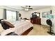 Bedroom with large bed, dresser, mirror and decor at 5827 High Grass Ln, Indianapolis, IN 46235