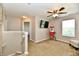 Versatile bonus room with carpet, ceiling fan, and natural light at 5827 High Grass Ln, Indianapolis, IN 46235