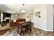 Cozy living room with fireplace, hardwood floors, and bar table at 5827 High Grass Ln, Indianapolis, IN 46235