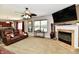 Bright living room with fireplace, large window, and modern decor at 5827 High Grass Ln, Indianapolis, IN 46235