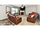 Inviting living room with plush seating, fireplace, and neutral decor at 5827 High Grass Ln, Indianapolis, IN 46235
