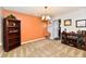Spacious living room with a neutral color scheme, bookshelf, and stylish light fixture at 5827 High Grass Ln, Indianapolis, IN 46235