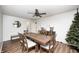 Light dining room showcasing wood table and chairs and ceiling fan at 6005 Apache Dr, Indianapolis, IN 46254