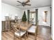 Well-lit dining room showcasing wood table and chairs, lamps and ceiling fan at 6005 Apache Dr, Indianapolis, IN 46254