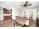 Light dining room showcasing wood table and chairs and view to kitchen at 6005 Apache Dr, Indianapolis, IN 46254
