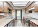 Efficient kitchen featuring a stainless steel sink, modern appliances, and ample cabinet space at 6005 Apache Dr, Indianapolis, IN 46254