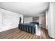 Open-concept living room with stylish decor, a brick fireplace, and hardwood floors at 6005 Apache Dr, Indianapolis, IN 46254
