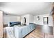 Spacious living room featuring a fireplace, modern sofas, and hardwood flooring at 6005 Apache Dr, Indianapolis, IN 46254