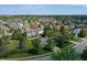 Wide aerial view showcasing the neighborhood, homes, and surrounding landscape at 6190 E Ayrshire Cir, Camby, IN 46113