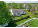 Aerial view of backyard with deck, hammock, fenced yard, and green grass at 6190 E Ayrshire Cir, Camby, IN 46113