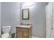 Standard bathroom features a single sink, vanity, and toilet at 6190 E Ayrshire Cir, Camby, IN 46113