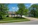 Charming single-story brick home with a well-manicured lawn and a spacious two-car garage at 6190 E Ayrshire Cir, Camby, IN 46113
