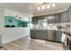 Beautiful kitchen with stainless steel appliances, undermount sink, and stylish gray cabinets at 6190 E Ayrshire Cir, Camby, IN 46113