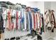 A walk-in closet is filled with clothing and shoes and features shelving at 6190 E Ayrshire Cir, Camby, IN 46113
