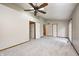 A bedroom featuring carpet flooring, neutral walls, and three doors at 6354 Cotton Bay N Dr, Indianapolis, IN 46254