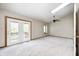 A bedroom featuring carpet flooring, neutral walls, a ceiling fan, and French doors leading to a balcony at 6354 Cotton Bay N Dr, Indianapolis, IN 46254