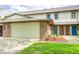 Charming home with a two-car garage, brick accents, and a well-manicured lawn at 6354 Cotton Bay N Dr, Indianapolis, IN 46254