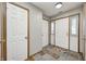 Inviting foyer with ceramic tile flooring, natural wood trim, and natural light at 6354 Cotton Bay N Dr, Indianapolis, IN 46254