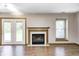 Cozy living room with hardwood floors and an elegant fireplace at 6354 Cotton Bay N Dr, Indianapolis, IN 46254