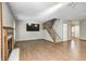 Spacious living room with hardwood floors, a fireplace, and stairway at 6354 Cotton Bay N Dr, Indianapolis, IN 46254