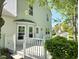 Charming white deck amidst mature trees and lush landscaping, creating a private and tranquil backyard setting at 6369 Kelsey Dr, Indianapolis, IN 46268