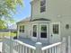 A backyard deck and white door provides access to the yard and home at 6369 Kelsey Dr, Indianapolis, IN 46268