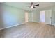 Bedroom with a ceiling fan and three open doorways at 6369 Kelsey Dr, Indianapolis, IN 46268
